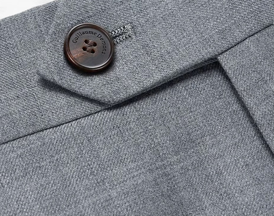 The waistband closure on the pants of the Borcelleclothes Men's Storm Grey Slim-Fit Suit, ensuring a secure and tailored fit.