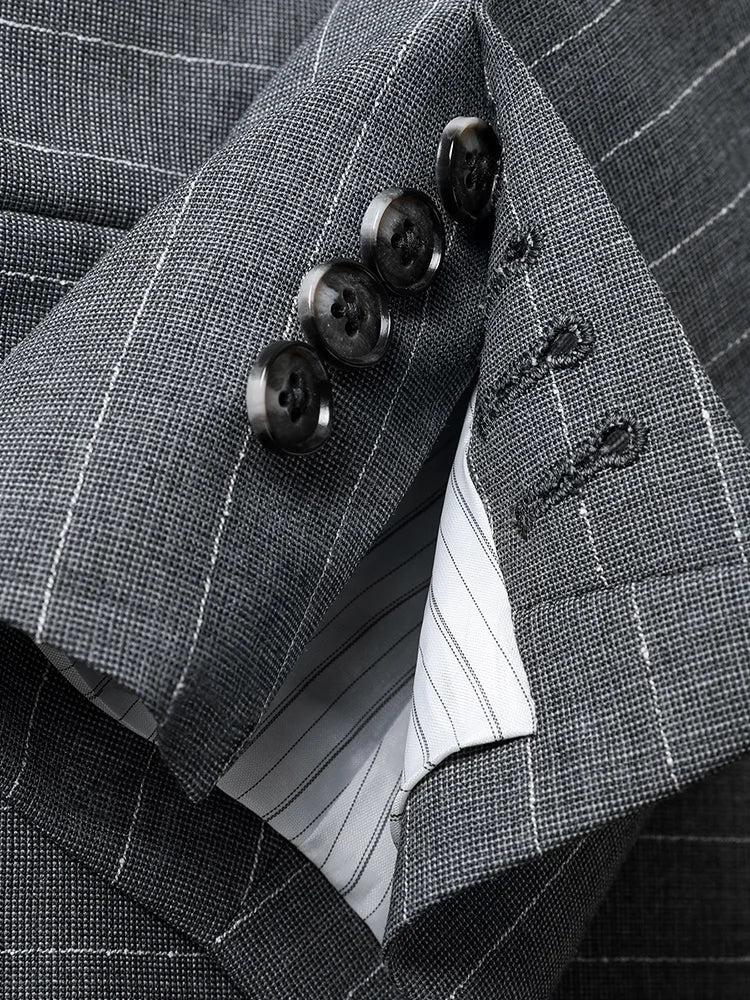 Unfastened functional sleeve placket with horn buttons — not a flaw, but a statement of craftsmanship. From Borcelleclothes.