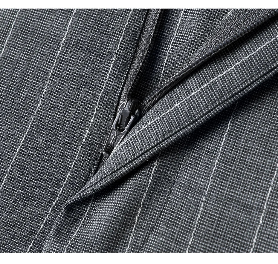 Close-up of the trousers’ unzipped fly, highlighting an inner structure. From Borcelleclothes.