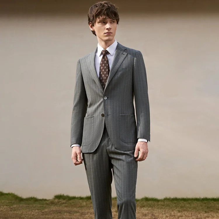 Men’s Storm Grey wool suit with wide-set pinstripes and patch pockets, styled with both shirt and tee. From Borcelleclothes.