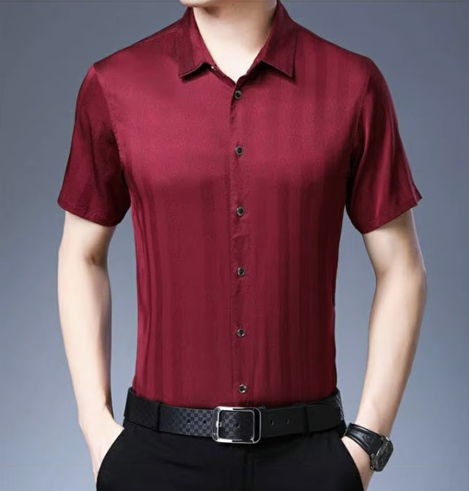 The front of the Men's Mulberry Silk Shirt from the Striped Collection in Light Burgundy, showcasing a refined minimalist design with subtle stripes that shift in visibility through the interplay of matte and glossy surfaces, highlighting its luxurious and dynamic quality. From Borcelleclothes.