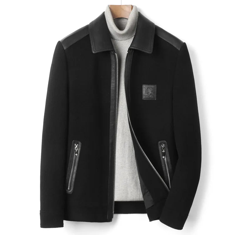 Men’s structured leather-wool jacket in Onyx, featuring a leather collar, shoulders, and back with soft wool panels, finished with cuffs and a lower band for a defined silhouette. From Borcelleclothes.