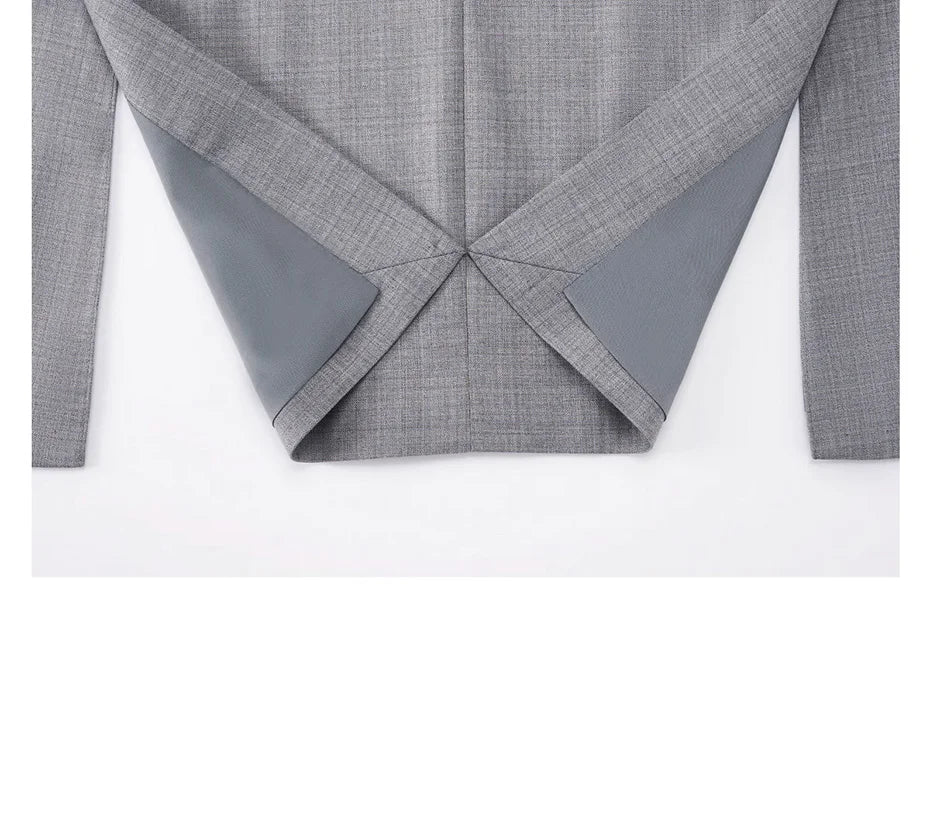 Unfolded hem view of the blazer revealing internal finishing and subtle lining. From Borcelleclothes.