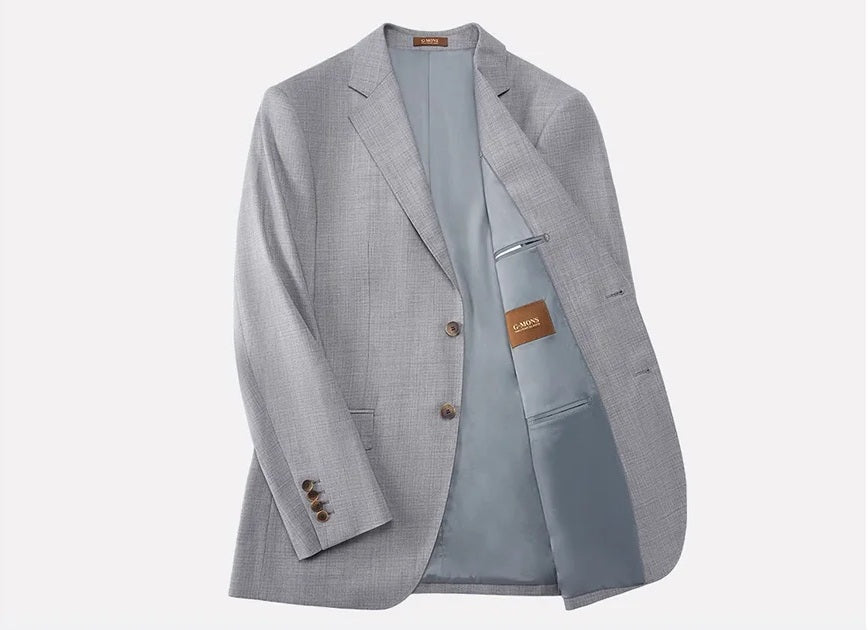 Left edge of blazer unfolded to display stitching and smooth lining texture. From Borcelleclothes.