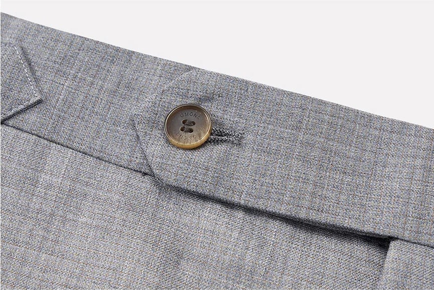 Close-up of waistband with horn button closure. From Borcelleclothes.