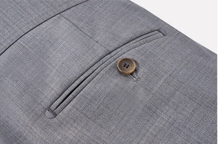 Rear double-welt pocket secured with horn button. From Borcelleclothes.