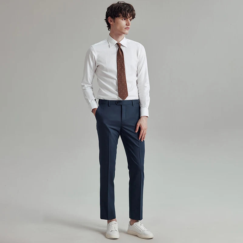 Model wearing River Bed tailored cropped trousers, watching to the side to highlight the clean silhouette and fit. From Borcelleclothes.