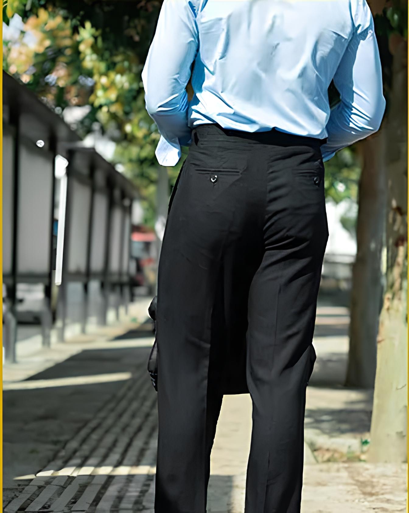 Back view of tailored linen trousers in Onyx, featuring double-welt pockets and crisp rear structure. From Borcelleclothes.