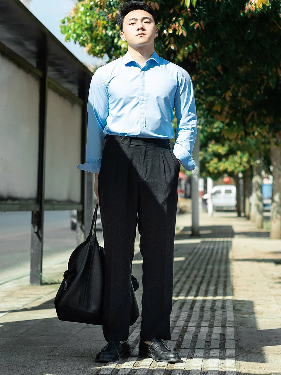 Model standing straight in Onyx linen trousers, emphasizing the structured leg line and clean waistband design. From Borcelleclothes.