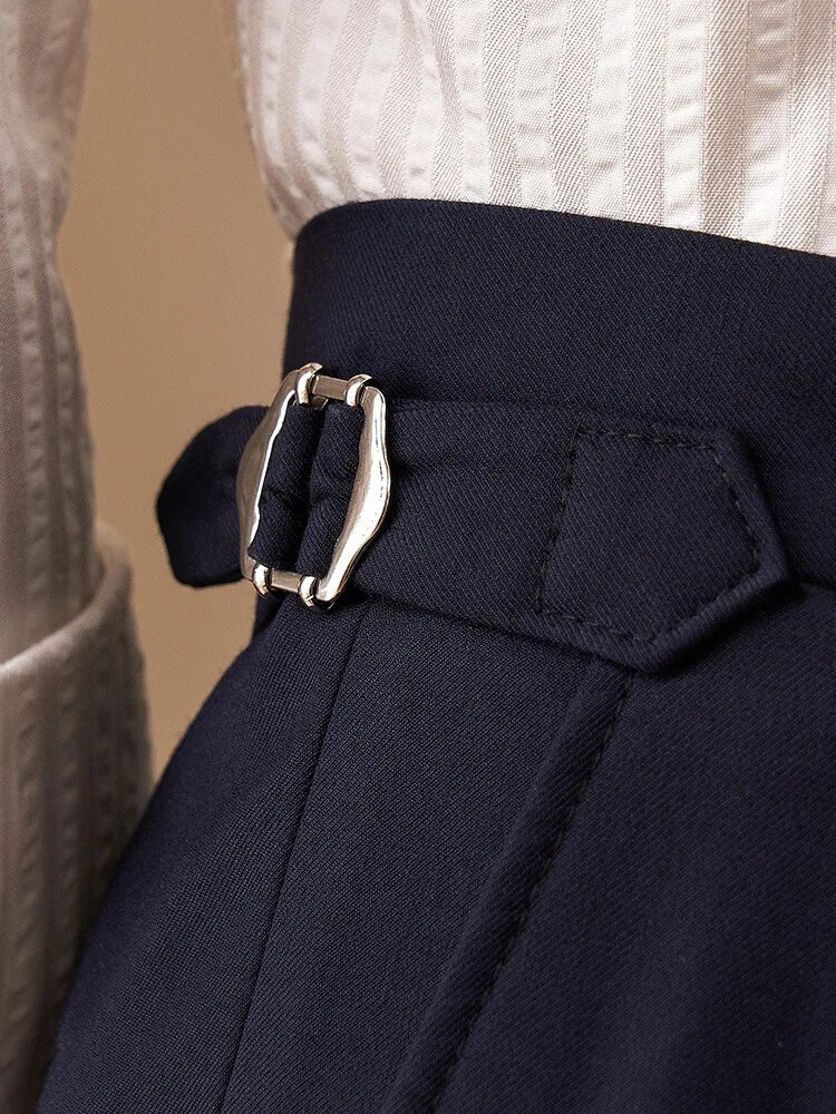 Waist detail of Midnight Express trousers showing side belt with polished metal buckle. From Borcelleclothes.