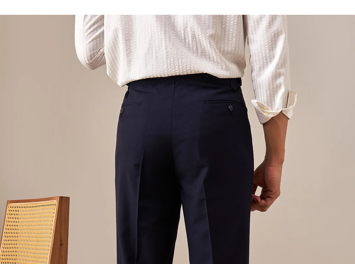 Back view of Midnight Express trousers showing double-welt pockets and structured waistband detail. From Borcelleclothes.