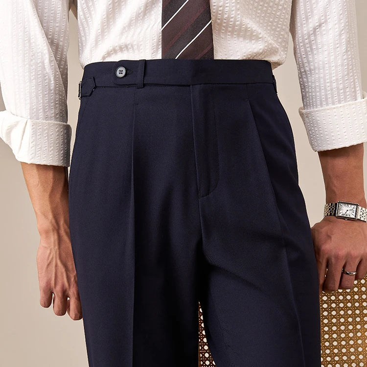 Upper front view of Midnight Express trousers highlighting waistband extension, front tucks, and loop detail. From Borcelleclothes.