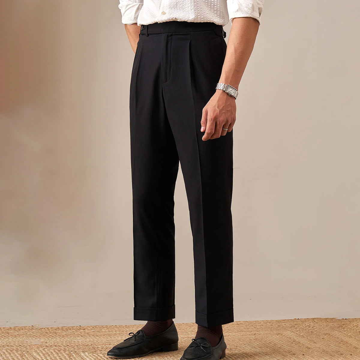 Model in Onyx trousers turned slightly to the side, showing straight silhouette and cropped hem. From Borcelleclothes.