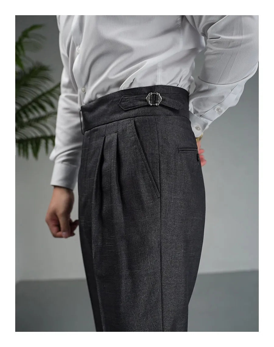 Upper left side view of Payne’s Grey trousers showing belt detail, slash pocket, and pleats. From Borcelleclothes.