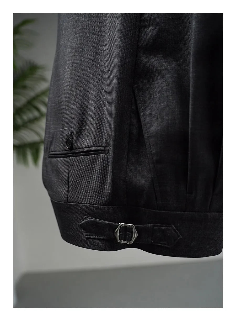 Payne’s Grey trousers displayed on hanger, showing straight cut, waistband detail, and double-welt pocket. From Borcelleclothes.