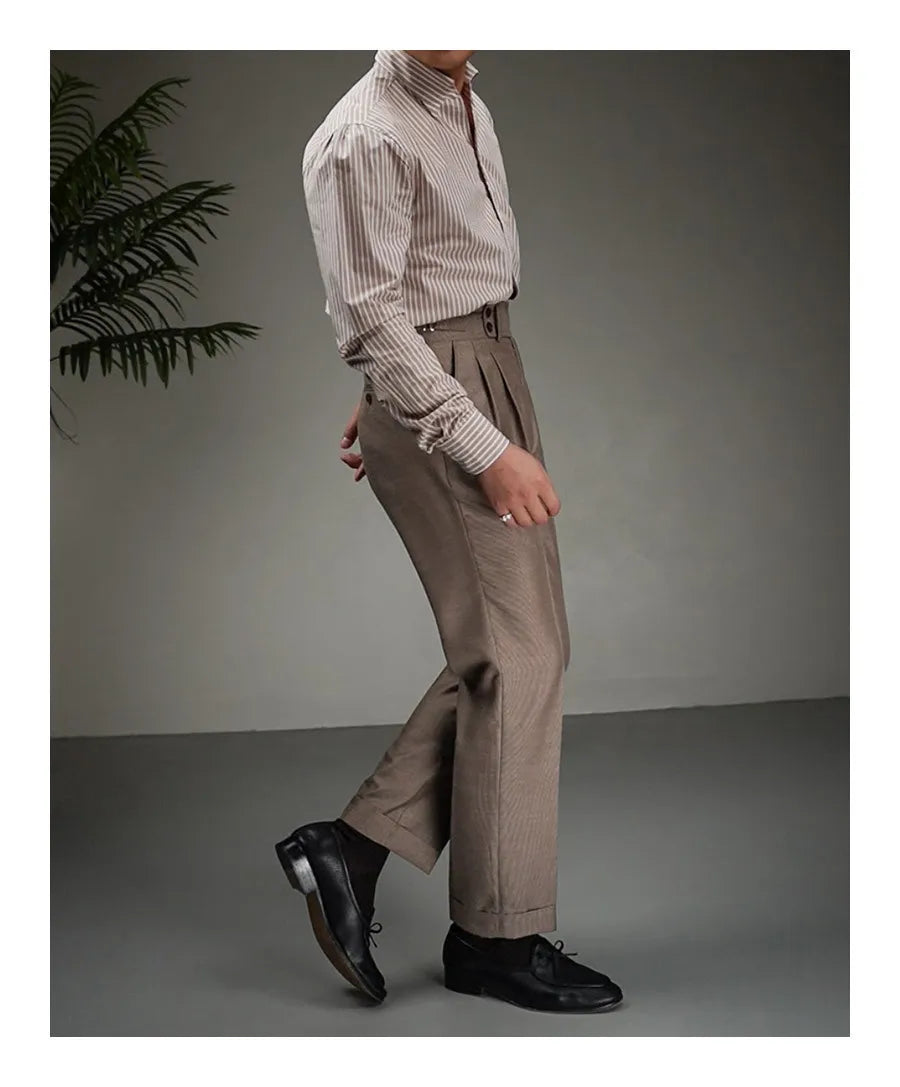Side view of model wearing tailored wool-blend trousers in Wenge, showing clean straight silhouette and cropped cuffs. From Borcelleclothes.