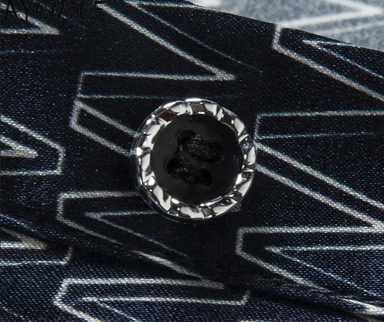 Detail of the front button placket on the W pattern silk polo, smooth gloss and tactile structure. From Borcelleclothes.