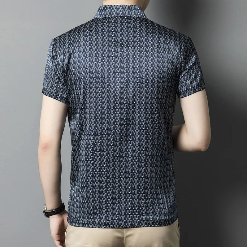 Back view of the printed Mulberry silk polo on model, showing clean silhouette and soft shine. From Borcelleclothes.