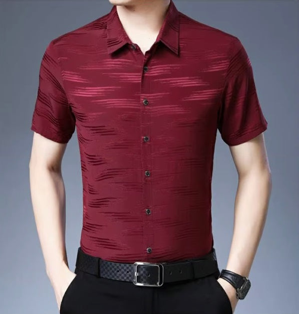 The front of the Men's Mulberry Silk Shirt from the Water Rippled Collection in Light Burgundy, featuring soft horizontal patterns that mimic the gentle movement of water ripples, enhanced by a play of matte and glossy finishes for a sophisticated, fluid look. From Borcelleclothes.