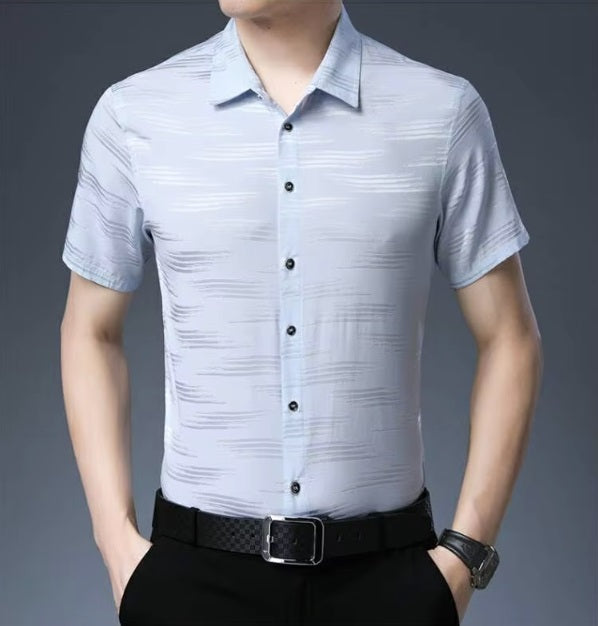 Men's Mulberry Silk Shirt from the Water Rippled Collection in Link Water, featuring soft horizontal patterns that mimic the gentle movement of water ripples, enhanced by a play of matte and glossy finishes for a sophisticated, fluid look. From Borcelleclothes.