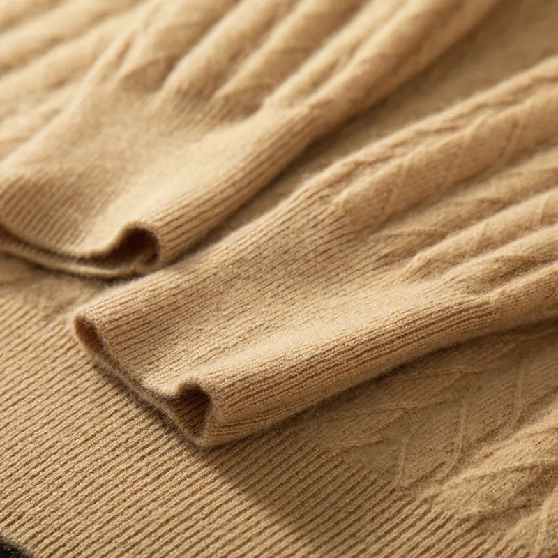 The ribbed sleeve hems on the Men's Wheat Spikes Alashan Cashmere Sweater in Lion, emphasizing its polished finish and snug fit. From Borcelleclothes.