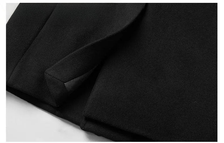 Men’s wool-cashmere coat with shearling peaked lapels in Onyx, close-up of the back vent. From Borcelleclothes.