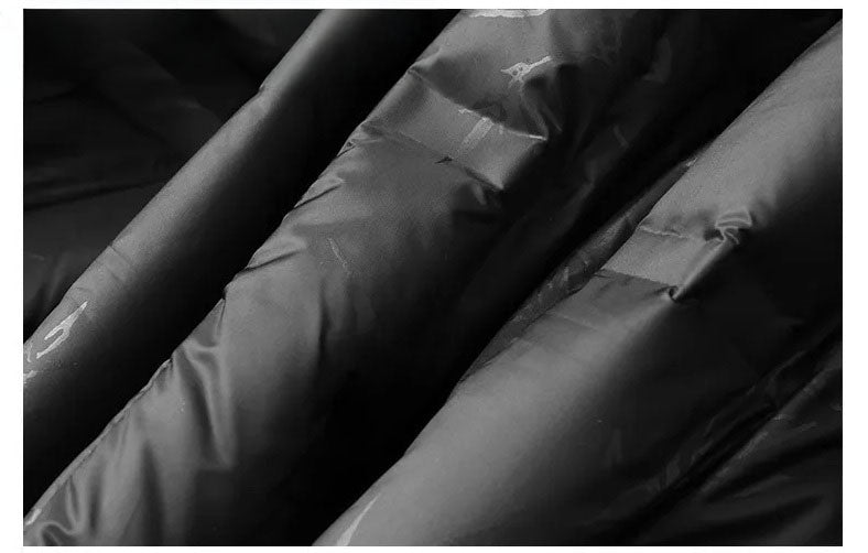 Men’s wool-cashmere coat with shearling peaked lapels in Onyx, close-up of the draping lining. From Borcelleclothes.