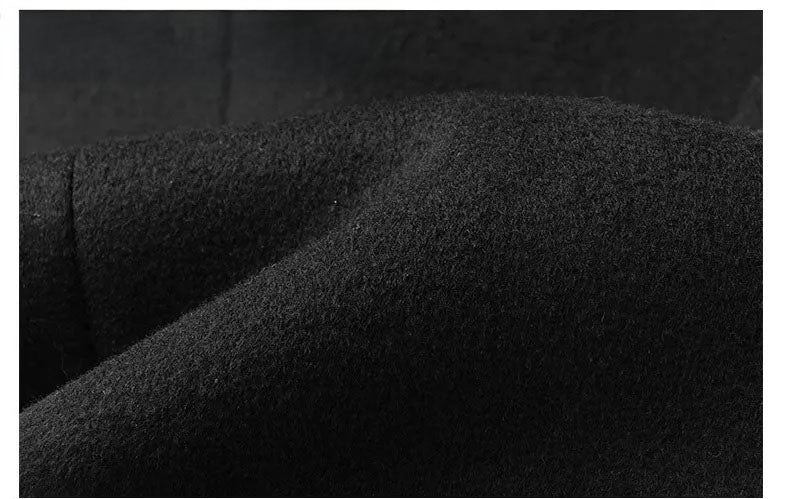 Men’s wool-cashmere coat with shearling peaked lapels in Onyx, close-up of draping wool fabric. From Borcelleclothes.