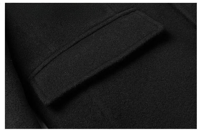 Men’s wool-cashmere coat with shearling peaked lapels in Onyx, close-up of the flap pocket. From Borcelleclothes.