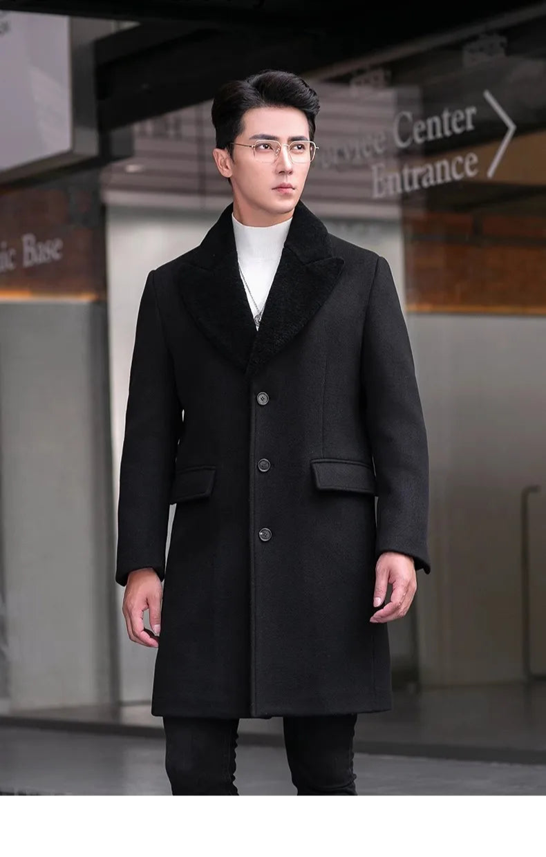 Men’s wool-cashmere coat with shearling peaked lapels in Onyx, model standing with arms straight at sides. From Borcelleclothes.