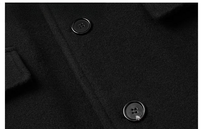 Men’s wool-cashmere coat with shearling peaked lapels in Onyx, close-up of two front buttons. From Borcelleclothes.