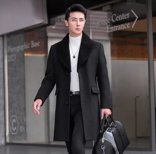 Men’s wool-cashmere coat with shearling peaked lapels in Onyx, straight cut, flap pockets, and down-filled lining for warmth and refined style. From Borcelleclothes.