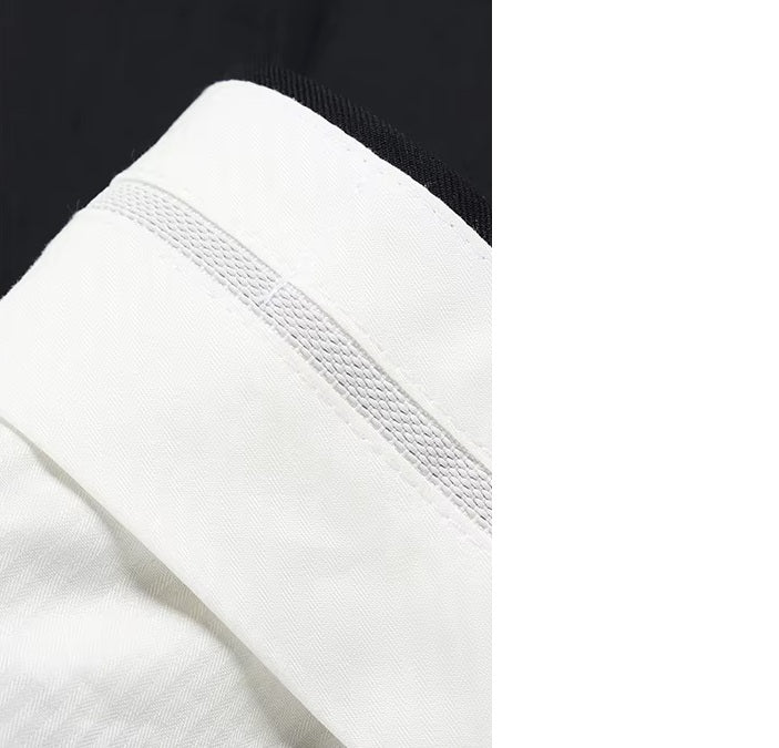 The gripper tape inside the waistband of the pants from the Borcelleclothes Men's Wool and Silk Blend Suit in Onyx Texture, designed to keep shirts securely tucked.