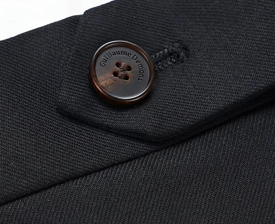 The secure button closure on the pants of the Borcelleclothes Men's Wool and Silk Blend Suit in Onyx Texture, ensuring a secure and comfortable fit.