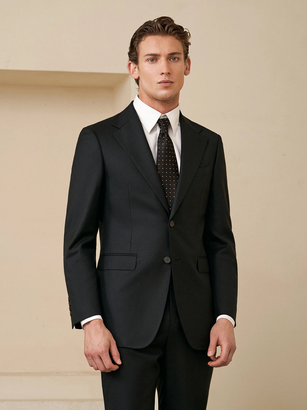 Borcelleclothes Men's Wool and Silk Blend Suit in Onyx, featuring a tailored single-breasted blazer with notch lapels, rounded front bottoms, and a streamlined silhouette paired with slim-fit trousers for a refined and contemporary look.