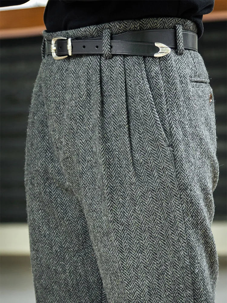 Close-up of the upper part of wool tweed trousers in Oslo Grey, revealing structured pleats and tailored waistband. From Borcelleclothes.