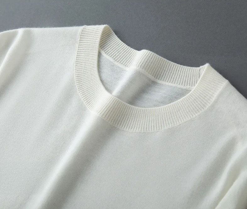 Detail of the 1×1 ribbed crew neck on the Platinum worsted cashmere sweater, shaped with clarity and softness — From Borcelleclothes.