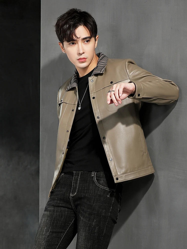 Model leaning against a wall in the woven-collar sheepskin jacket, Shadow — From Borcelleclothes.