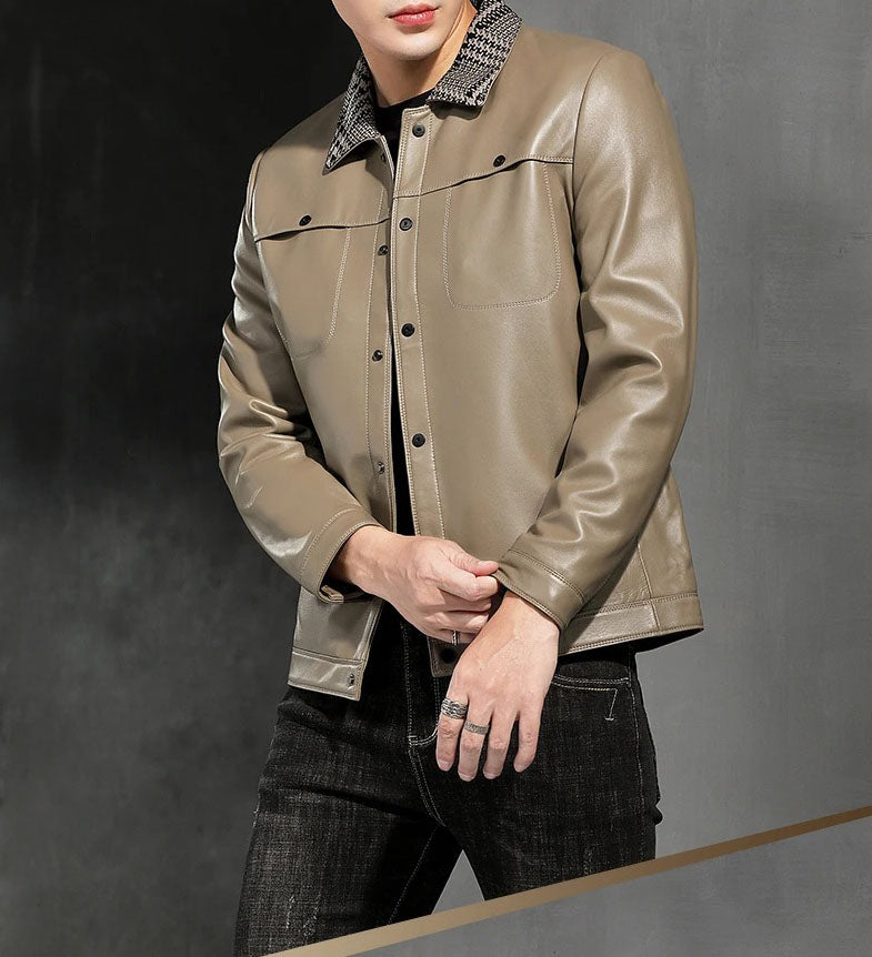 Model touching the snap cuff of the woven-collar sheepskin jacket, Shadow — From Borcelleclothes.