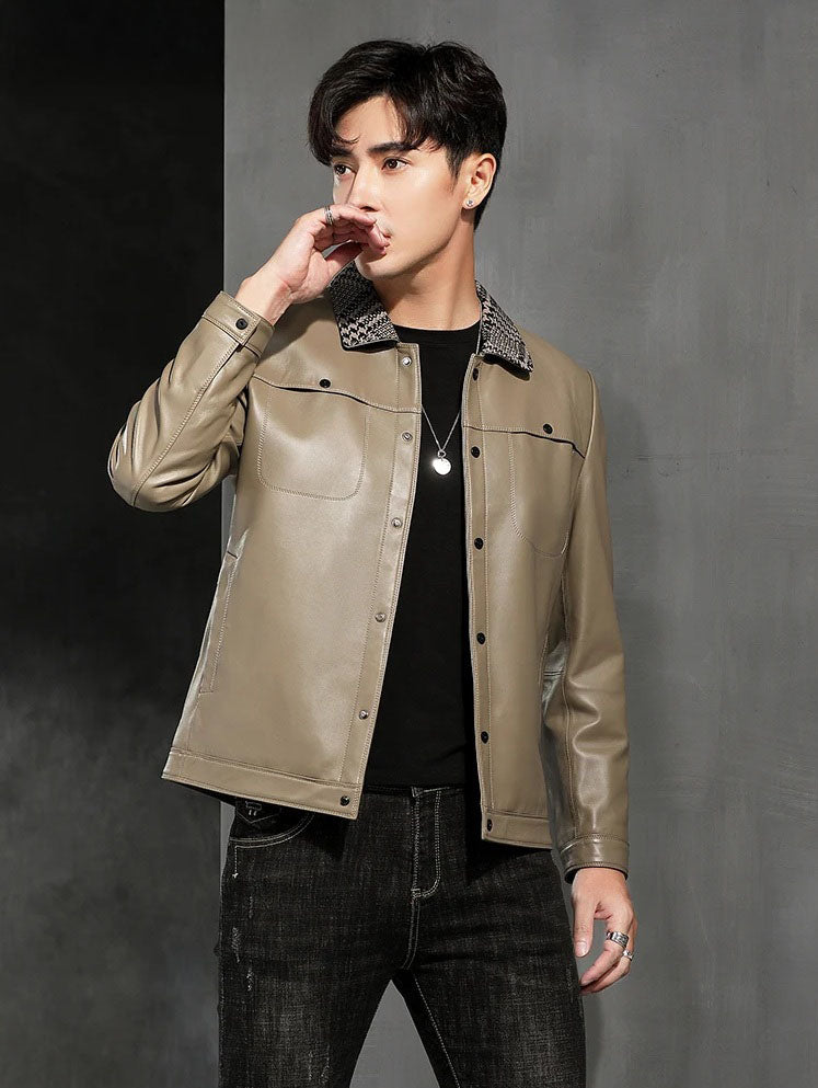 Model touching lips while wearing the woven-collar sheepskin jacket in Shadow — From Borcelleclothes.