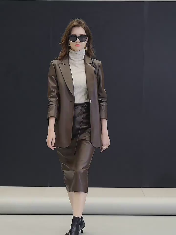 Video showcasing a Women’s single-breasted sheepskin leather blazer — a softly structured silhouette with peaked lapels, a single ornate button, and quiet gold-toned accents, crafted for movement and presence without insistence. From Borcelleclothes.