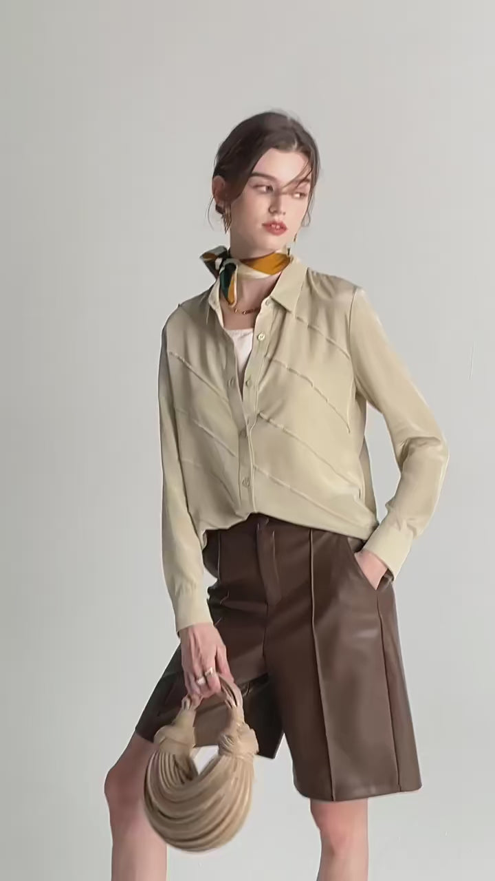 Video showcasing a Women's Mulberry silk shirt in four colors with diagonal seamed folds and pointed collar. From Borcelleclothes.