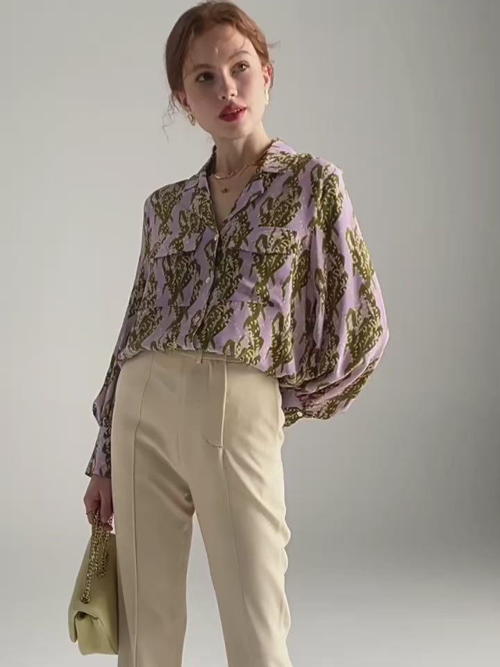 Video showcasing a Women's 100% Mulberry silk crepe de chine shirt with pastel floral print, notched collar, and flap pockets. From Borcelleclothes.