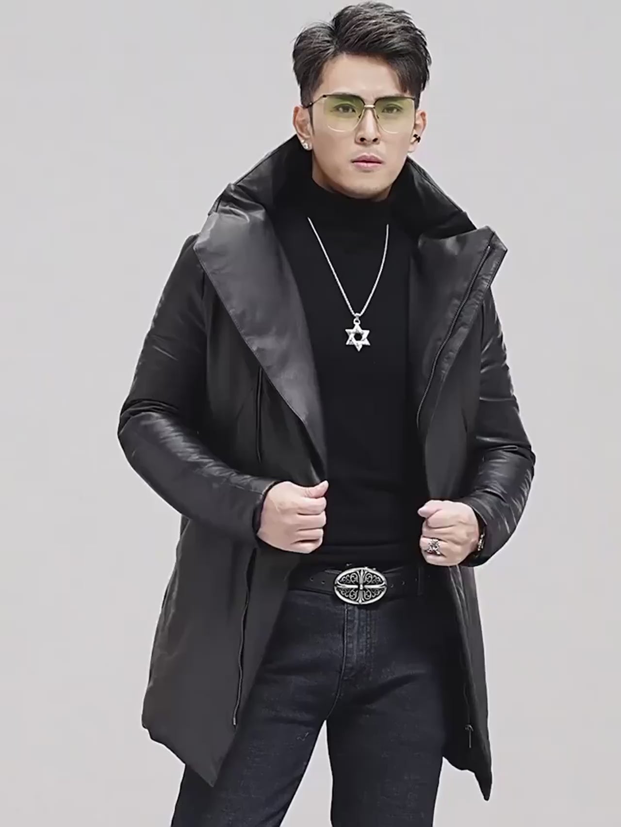 Video showcasing a Men’s mid-thigh sheepskin down jacket in Onyx featuring expanded collar with hood-inspired structure, diagonal zipper, and angular panel construction. From Borcelleclothes.