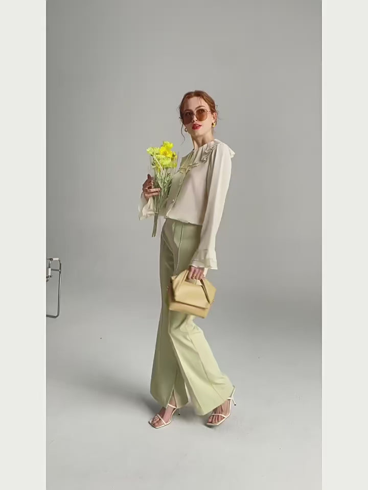 Video showcasing a Women's Romantic Pearl Bush Blouse crafted from 6A Grade Mulberry Silk, featuring a double-layered pilgrim collar with pleats and flounce cuffs for a vintage-inspired, luxurious look. From Borcelleclothes.