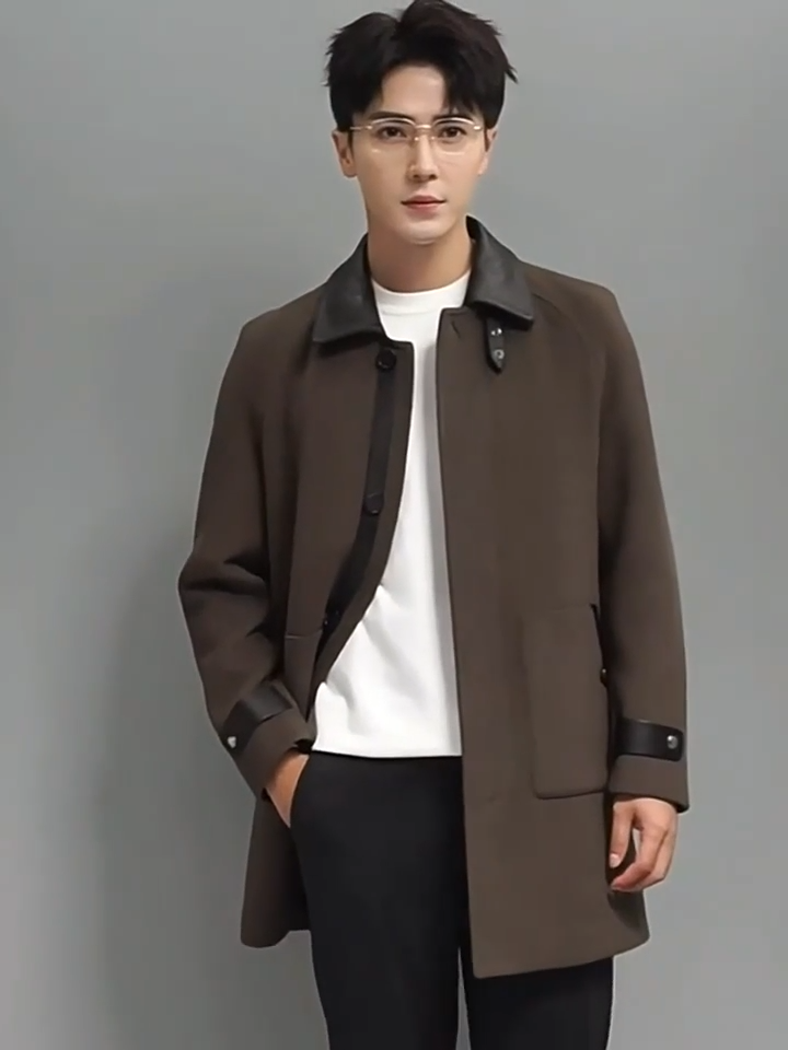 Video showcasing a Men’s Makara wool-cashmere coat with raglan sleeves and leather accents on collar, placket, and cuffs, inspired by the mythical guardian Makara — blending softness and strength. From Borcelleclothes.
