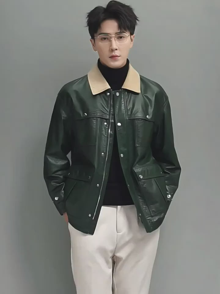 Video showcasing a Men’s cow leather jacket in Outer Space with a contrast corduroy collar; features a refined sheen, clean snapped placket, and firm structure for a modern, confident silhouette. From Borcelleclothes.