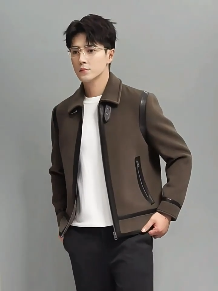 Video showcasing a Men's Luxury wool-cashmere bomber jacket with sheepskin leather trim in Makara, featuring vertical back leather stripes, leather-framed zipper, and collar strap with metal buckle – from Borcelleclothes.