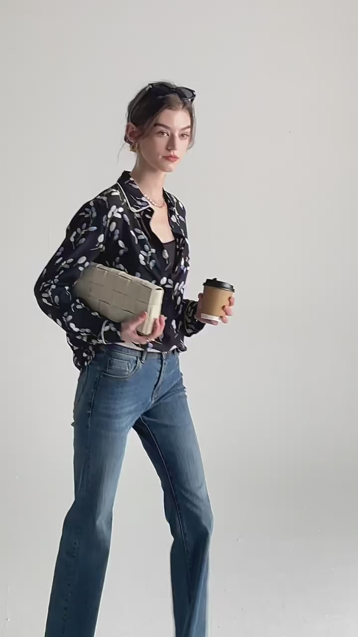 Video showcasing a women's silk shirt with berry-inspired print, featuring a rounded collar and white contrast piping. From Borcelleclothes.