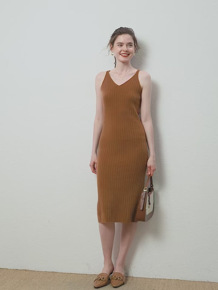 Video showcasing an Elegant Women's Slimming Midi Dress in Sienna, crafted from luxurious cashmere wool with a ribbed texture and figure-enhancing V-necklines on the front and back. From Borcelleclothes.